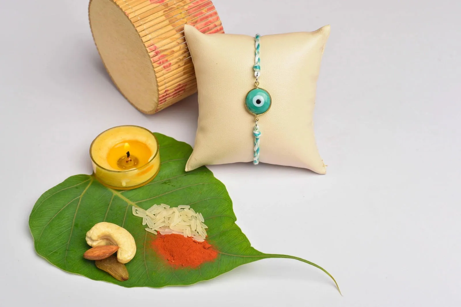 Designer White Mint Green Onyx Evil Eye Rakhi Set with Roli and Chawal for Raksha Bandhan